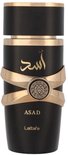 Flacon noir avec des détails dorés, dont deux bandes dorées qui se croisent et l'inscription 'ASAD' en lettres arabes dorées.
