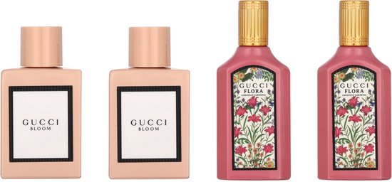 Twee effen roze Gucci parfumflacons en twee roze parfumflacons met bloemenprint.