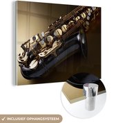 MuchoWow® Glasschilderij 120x90 cm - Schilderij acrylglas - Close-up van een saxofoon - Foto op glas - Schilderijen