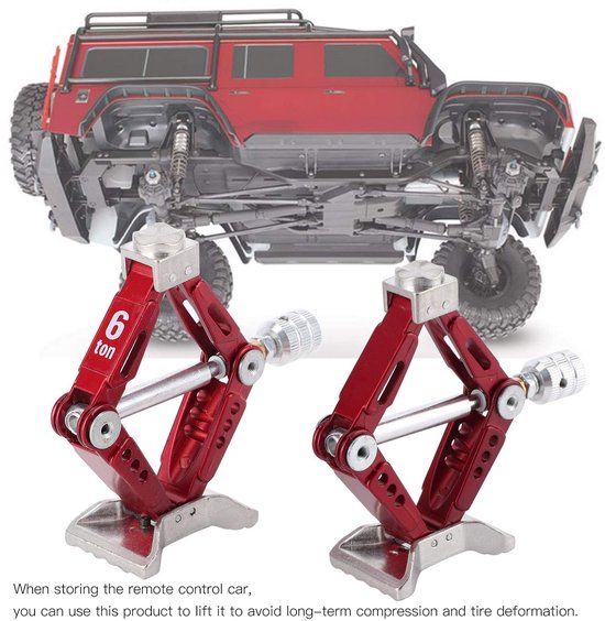 Twee rode schaarkrikken met een zilveren schroefmechanisme. Op de linker krik staat '6 ton'.