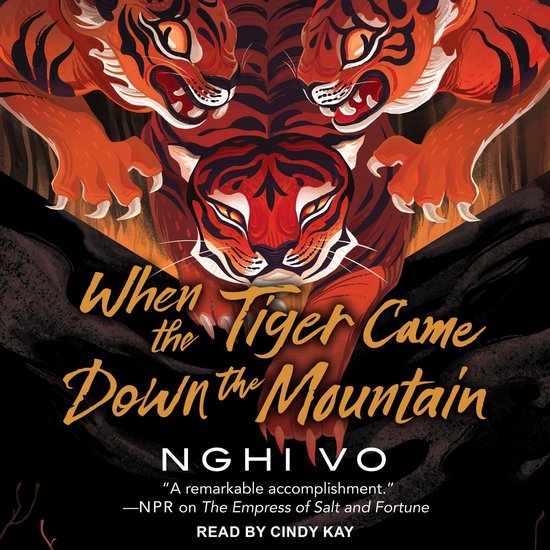 Boekcover met de titel 'When the Tiger Came Down the Mountain' in gele letters, met drie tijgergezichten en klauwen.