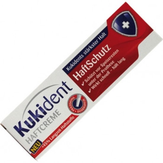 Kukident Haftcreme tube met "NEU +45% Langzeit-Haftstoffe" en schild-logo.