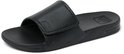 Zwarte Reef slipper met gestructureerde voetbed en Reef logo.