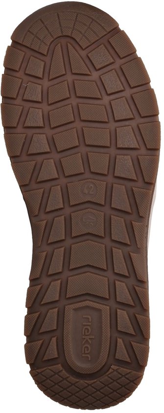 Onderkant van een bruine sneakerzool met profiel.