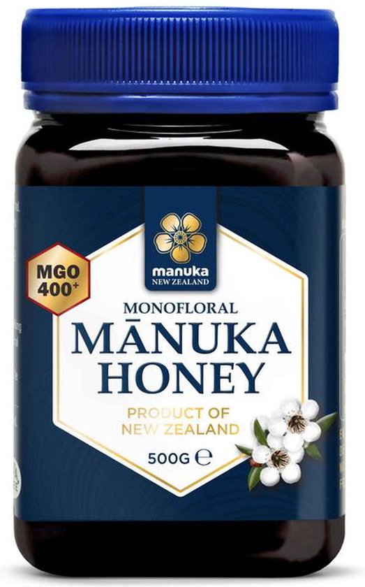 Donkerbruine pot Manuka Honing 500g met blauw deksel. Goud en wit label met tekst 'Monofloral Manuka Honey'.