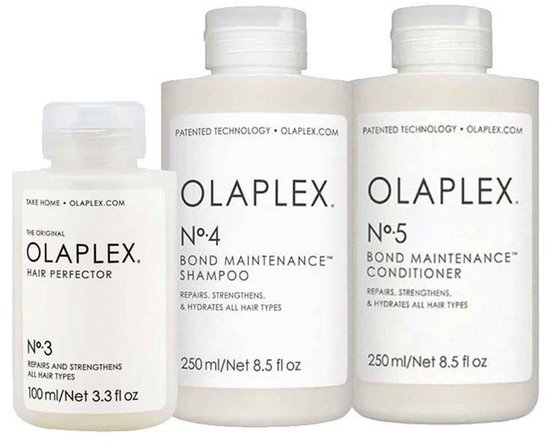 Olaplex set met No.3 Hair Perfector, No.4 Shampoo en No.5 Conditioner in witte flessen met zwarte tekst.