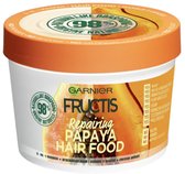 Masque 3-en-1 Garnier Fructis Hair Food Papaye pour cheveux abîmés dans un pot blanc avec couvercle orange.
