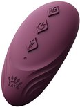 Appareil ovale violet avec trois symboles sur le dessus.