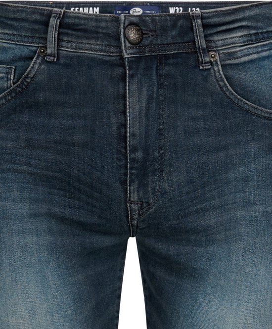 Blauwe Petrol Industries slim fit jeans met vintage wassing, metalen knoop en label op de tailleband.