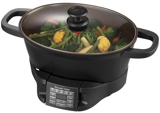 Zwarte multicooker met deksel, gevuld met gestoomde groenten zoals broccoli, wortelen en sperziebonen.