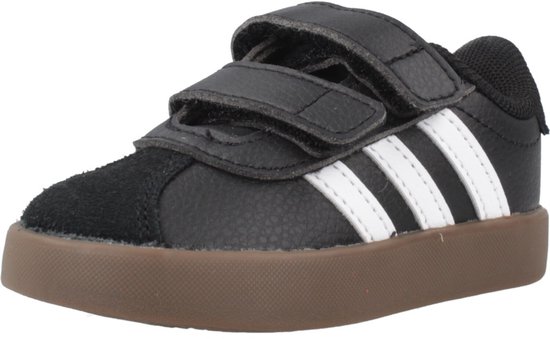 Zwarte Adidas sneaker met bruine zool, witte strepen en klittenbandsluiting.