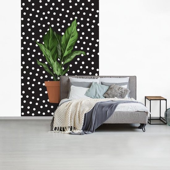 Illustration d'une plant aux feuilles luxuriantes sur fond noir à pois blancs 145x220 cm