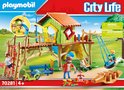 Playmobil City Life speeltoestel met huisje, glijbaan, schommel, klimmuur, scooter en oranje krokodillenwip.