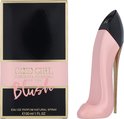 Roze pumpvormige parfumfles naast de verpakking 'Good Girl Carolina Herrera Blush'.