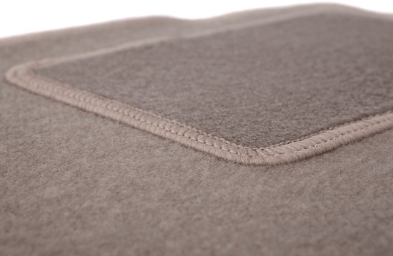 Detail van een beige automat met contrasterende bies.
