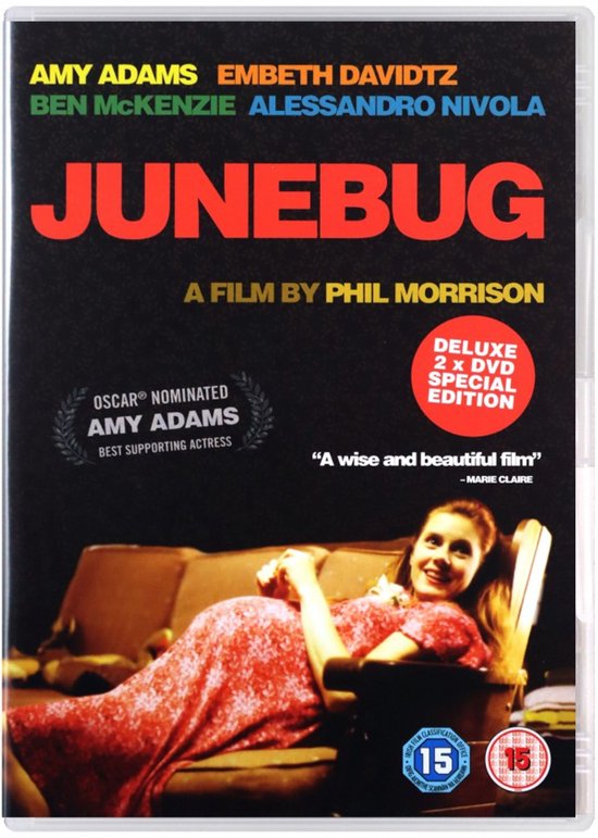DVD-hoes met de titel JUNBUG, A FILM BY PHIL MORRISON. Een zwangere vrouw in een rood jurkje ligt op een bank.