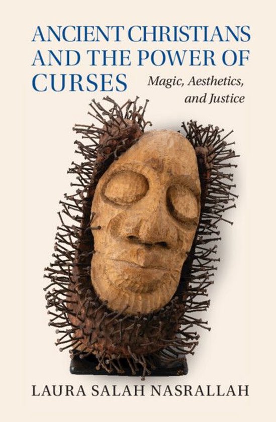 Boekomslag: een houten gezicht omringd door spijkers, titel 'Ancient Christians and the Power of Curses' van Laura Nasrallah.