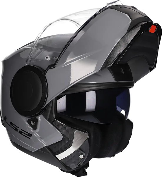 Casque de moto LS2 gris avec visière rabattable et ventilation, montré avec la mentonnière relevée.