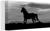 Canvas Schilderij Silhouet van een wild mustang paard - zwart wit - 40x20 cm - Wanddecoratie