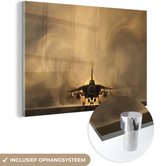 MuchoWow® Glasschilderij 90x60 cm - Schilderij acrylglas - Een straaljager bij een tornado - Foto op glas - Schilderijen