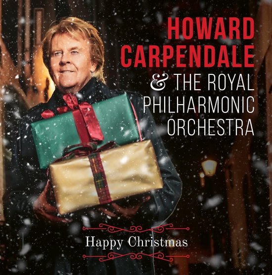 Howard Carpendale met geschenken en kerstbomen op de achtergrond.