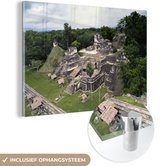 MuchoWow® Glasschilderij 120x80 cm - Schilderij acrylglas - Bovenaanzicht van de stad Tikal in Guatemala. - Foto op glas - Schilderijen