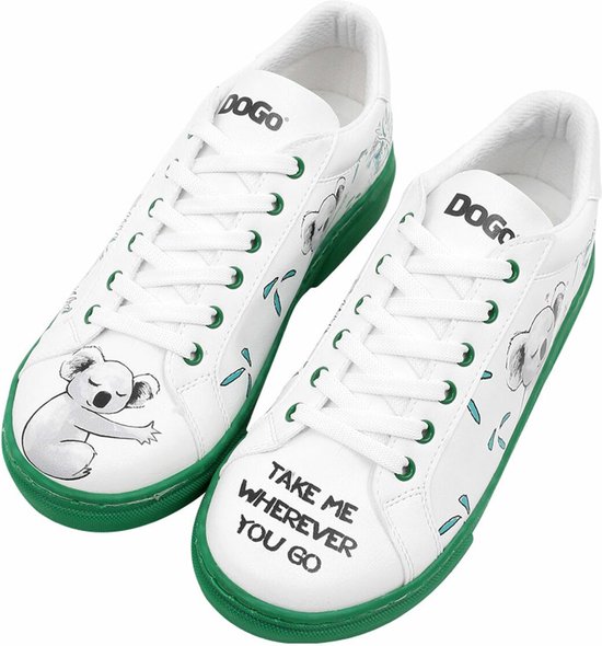 Baskets blanches avec imprimé koala, semelle verte et inscription 'TAKE ME WHEREVER YOU GO'.