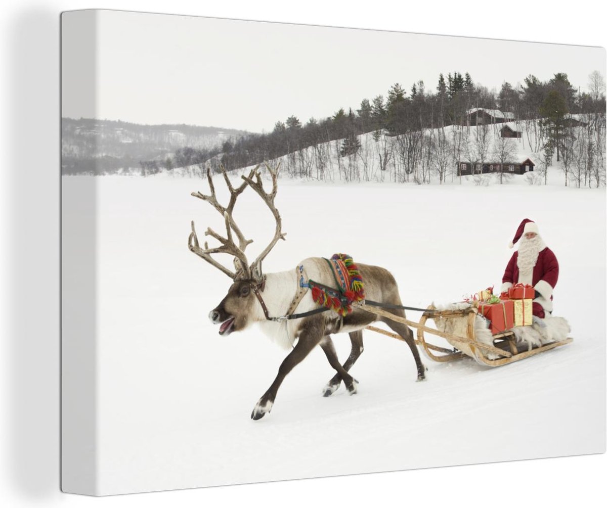Rendier met de kerstman op een slee canvas 90x60 cm - Foto print op Canvas schilderij (Wanddecoratie woonkamer / slaapkamer) / Wilde dieren Canvas Schilderijen