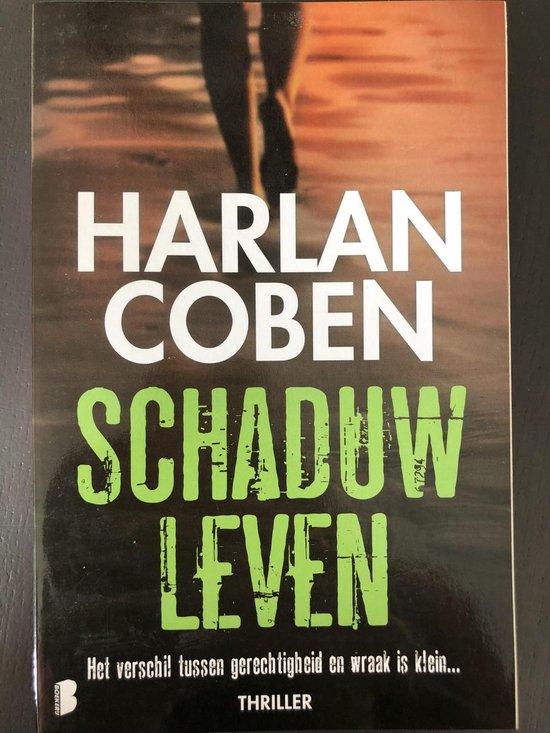 Boekcover met de titel 'Schaduwleven' van Harlan Coben, met daarop een weerspiegeling in het water en de tekst 'Het verschil tussen gerechtigheid en wraak is klein... THRILLER'.