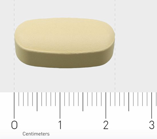 Een ovale, lichtgele tablet met een liniaal die de grootte aangeeft (ongeveer 1.7 cm).