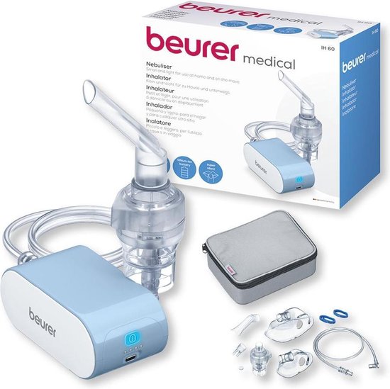 Beurer medische inhalator, compleet met blauw apparaat, vernevelaar, maskers, tas en toebehoren, naast de verpakking.