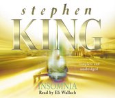 Boekcover van 'Insomnia' door Stephen King, met de titel in grote letters en een wazige afbeelding van een persoon in een gouden gloed.