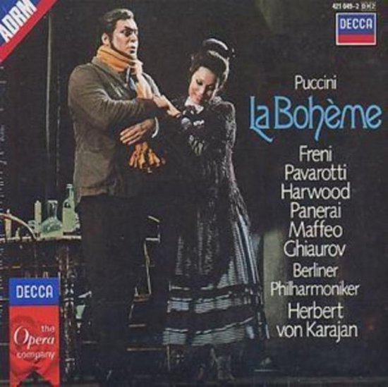 Man en vrouw in klederdracht poseren. Tekst: Puccini La Bohème.