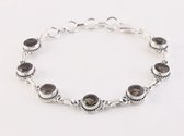 Bewerkte zilveren schakelarmband met rookkwarts