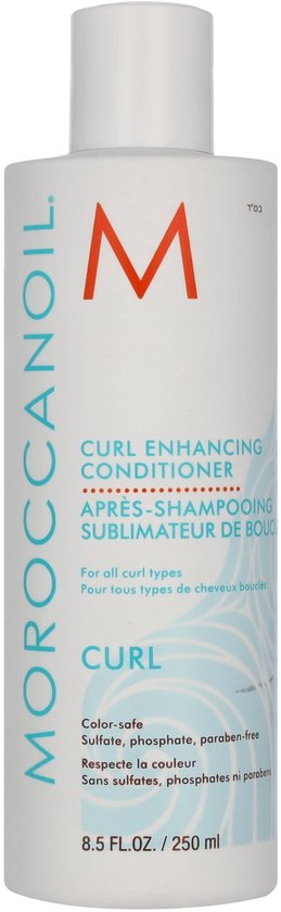 Witte fles Moroccanoil "Curl Enhancing Conditioner". Tekst in oranje, wit en blauw. Golvend blauw patroon.
