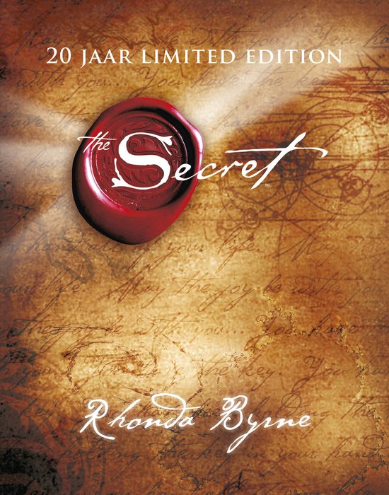 Boekomslag 'The Secret', 20 jaar Limited Edition, met een rode zegelring en de tekst 'The Secret' en 'Rhonda Byrne'.