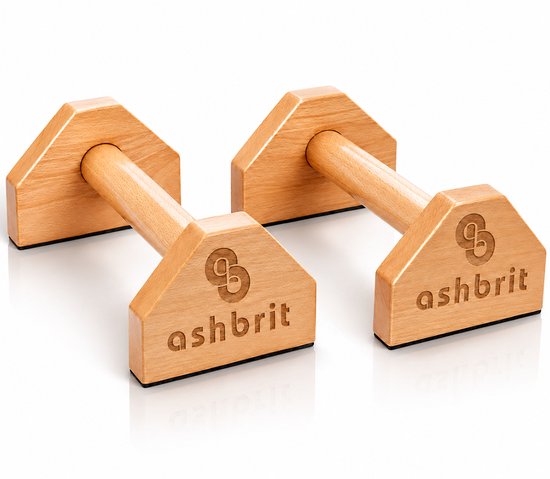 Twee houten push-up bars met zwarte antislip onderkant. Inscriptie 'ashbrit' en logo zichtbaar op de driehoekige basis.