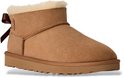 Bruine UGG laars met bruine strik en witte vachtvoering.