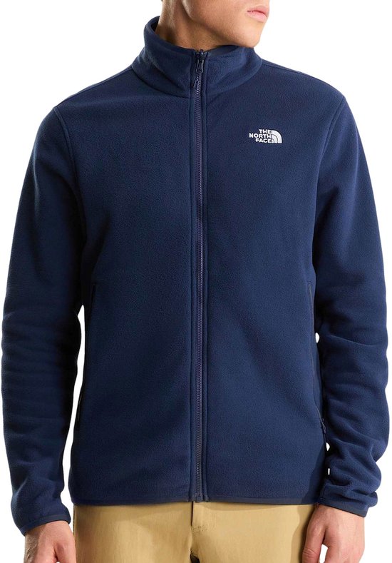 Man in donkerblauw The North Face fleece vest met ritssluiting en logo op borst.