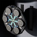 Ronde zwarte boksmachine met 6 grijze targets, LED-verlichting en klittenbandbevestiging aan de muur.