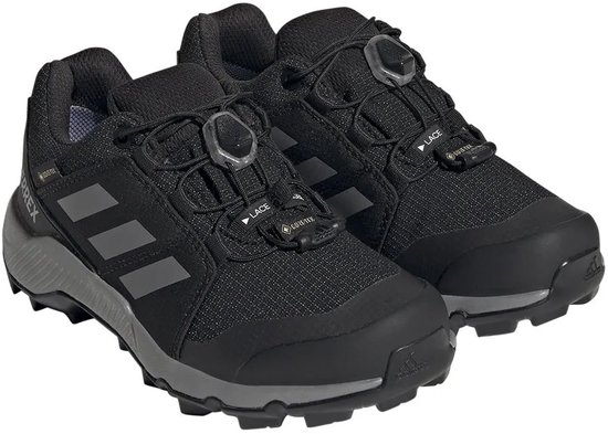 Paar zwarte wandelschoenen met grijze zolen en een BOA-vetersysteem.