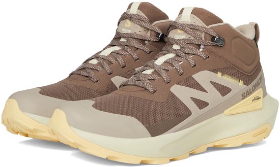 Chaussures de randonnée Salomon brunes avec accents beiges et semelle jaune. Modèle Elixir Activ Mid GTX.