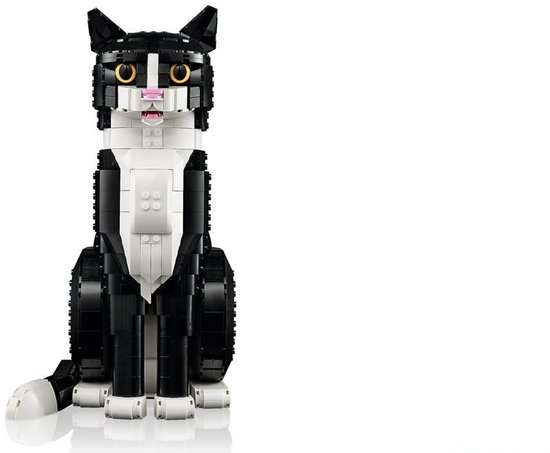 Zwart-witte LEGO kat zittend, met staart, oren en witte poten.