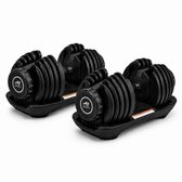 Twee zwarte AJ-SPORTS verstelbare dumbbells op zwarte standaards.