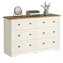 Commode blanche à 6 tiroirs, plateau en bois et décoration sur le plateau.