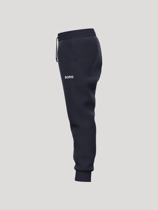 Zijaanzicht van een donkerblauwe joggingbroek met het witte 'BORG' logo op de zijkant van het bovenbeen.
