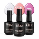 Drie flessen Velura Bottle Builder nagelproduct in wit, vintage roze en rosy pink, met gekleurde druppels erachter.