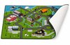 Speelkleed met stadsplattegrond, wegen, gebouwen en water. De onderkant van het kleed is zichtbaar.