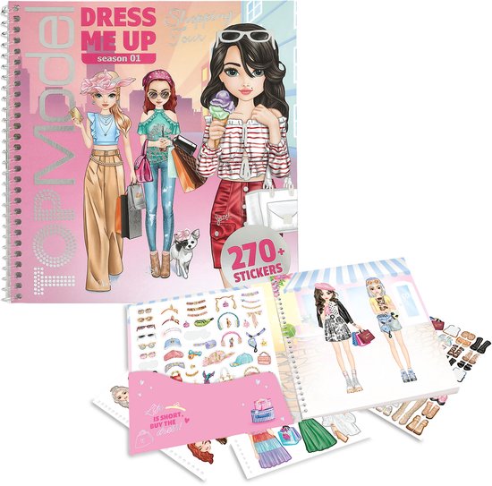 Un livre de stickers ouvert avec 'DRESS ME UP Shopping Tour season 01' sur la couverture. Montre des modèles et des accessoires.
