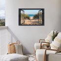 Decoratieve poster met een open raam dat uitkijkt op een zonnig strand met duinen en de zee, geplaatst boven een bankje.